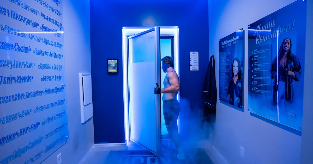 Client in a whole-body cryotherapy chamber with cold vapor at iCRYO St. Johns, FL